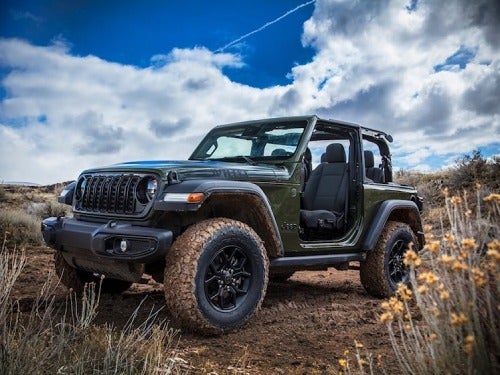 2024 Jeep Wrangler exterior view of jeep with doors off with mud on tires